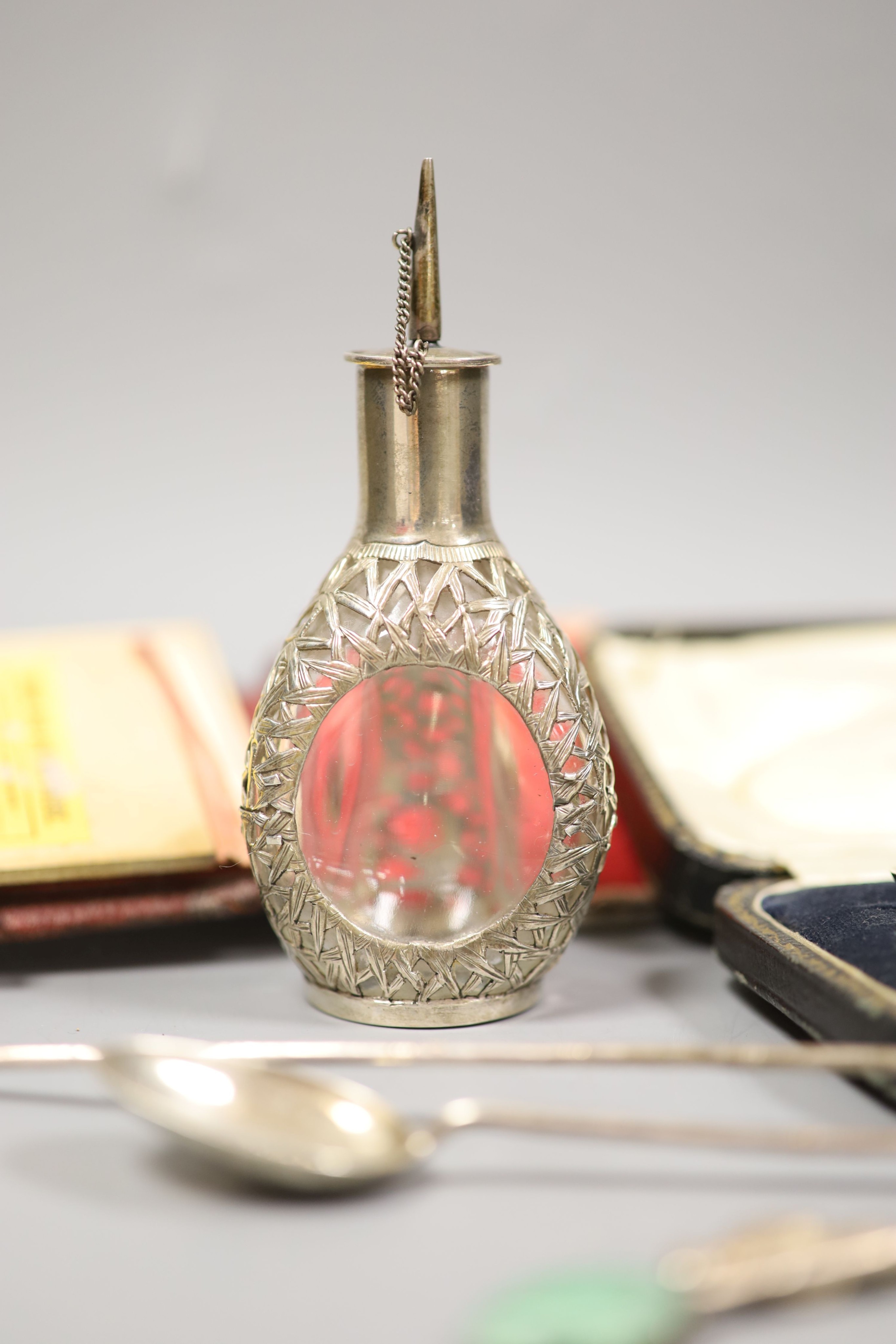 A modern silver spoon by Amy Sandheim (a.f.), a cased silver christening pair, a mounted bridge pad and Chinese cocktail spoons with jade terminals by Tack Hing, one other spoon and a similar scent bottle.